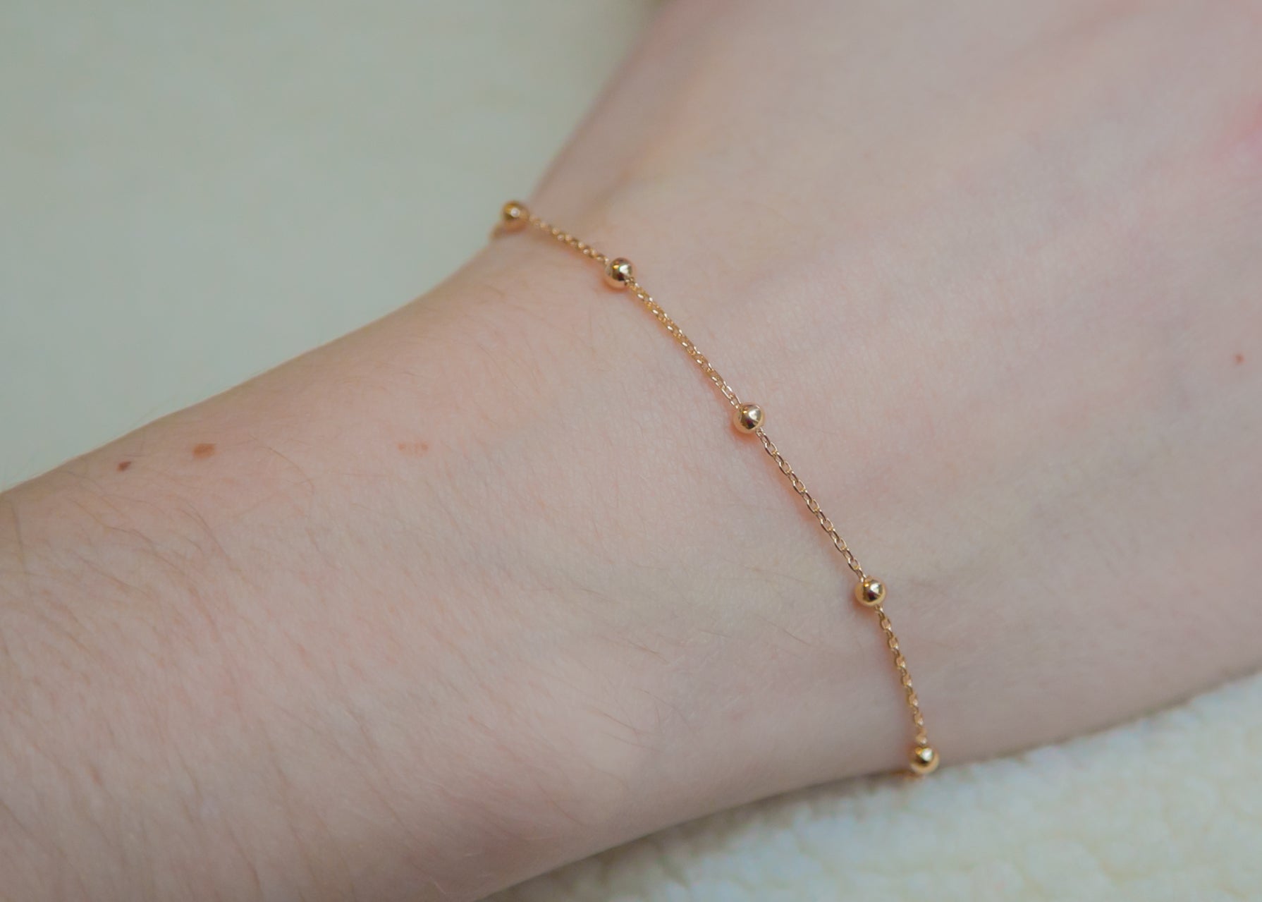 Bracelet petites boules plaqué or