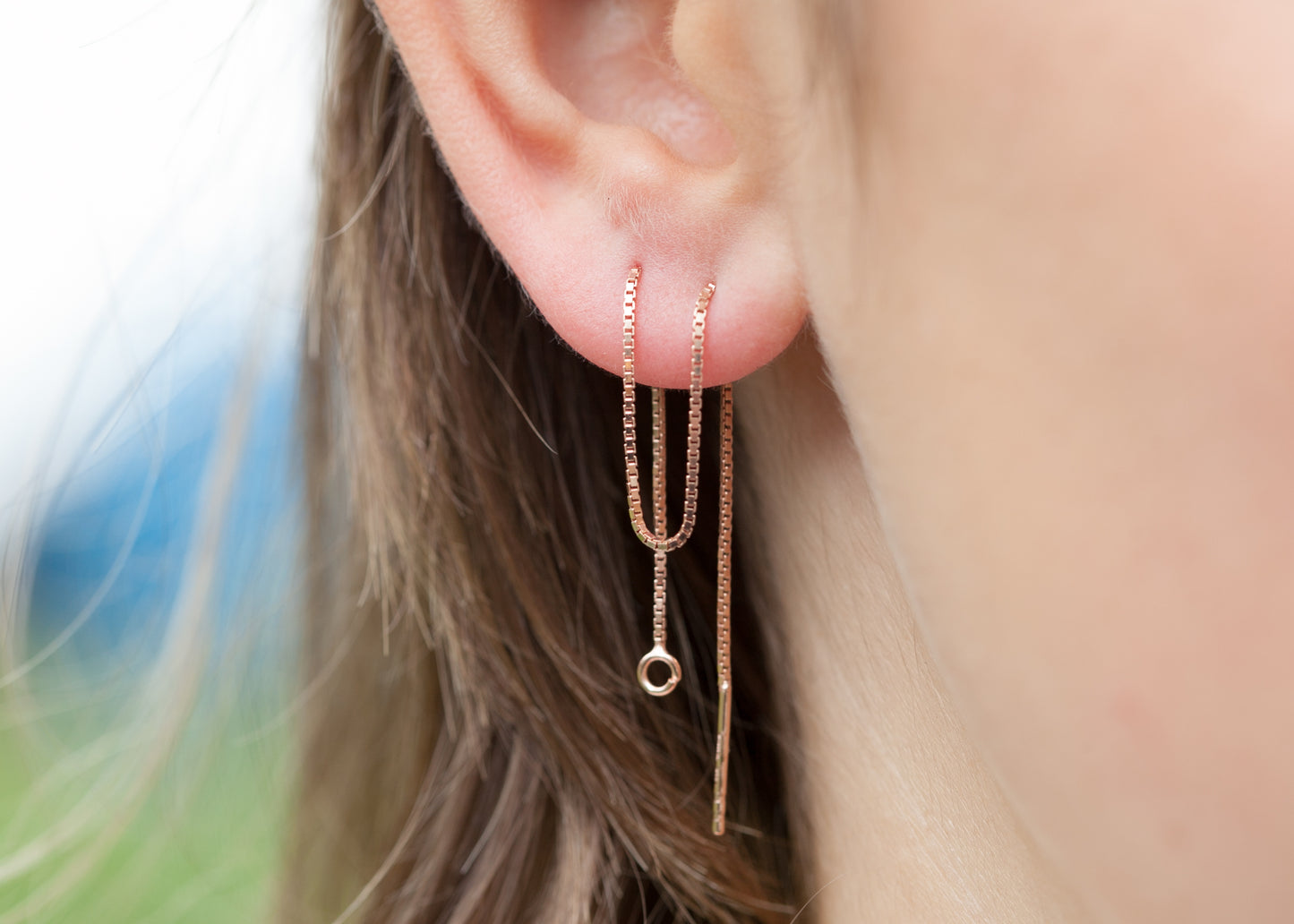 boucles oreilles chaine traversante plaqué or rose