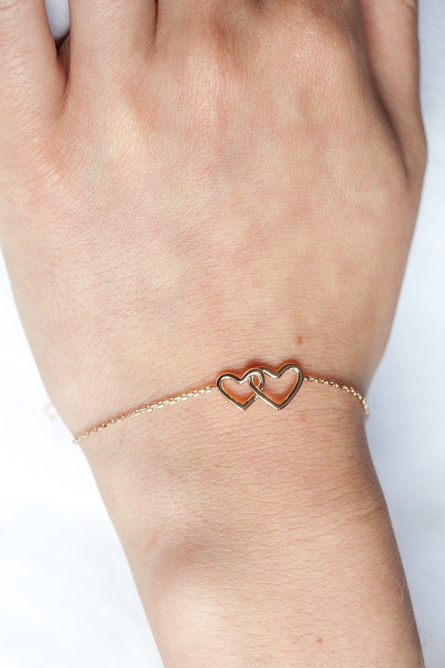 Bracelet coeurs entrelacés plaqué or