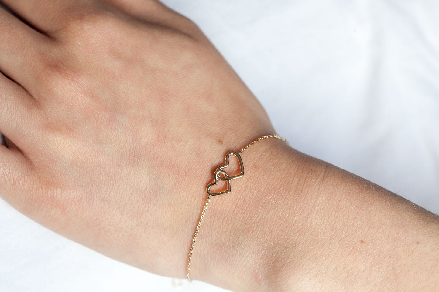 Bracelet coeurs entrelacés plaqué or