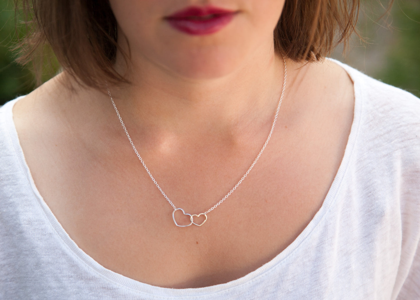 Collier deux coeurs entrelacés en argent