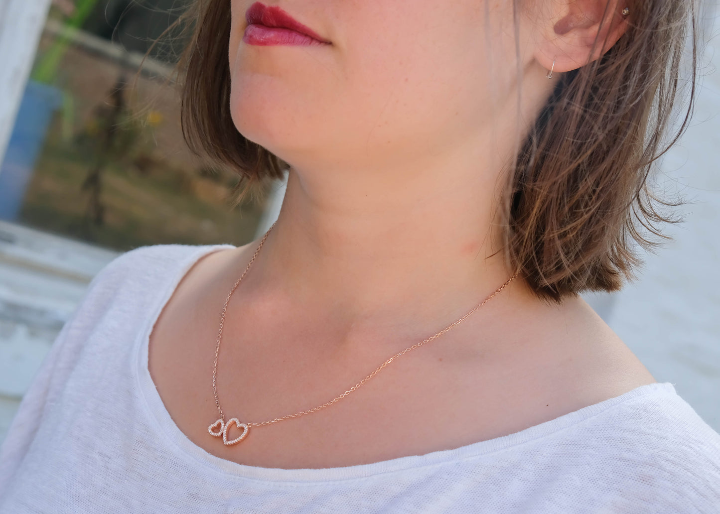 Collier 2 coeurs sertis de zircons plaqué or rose