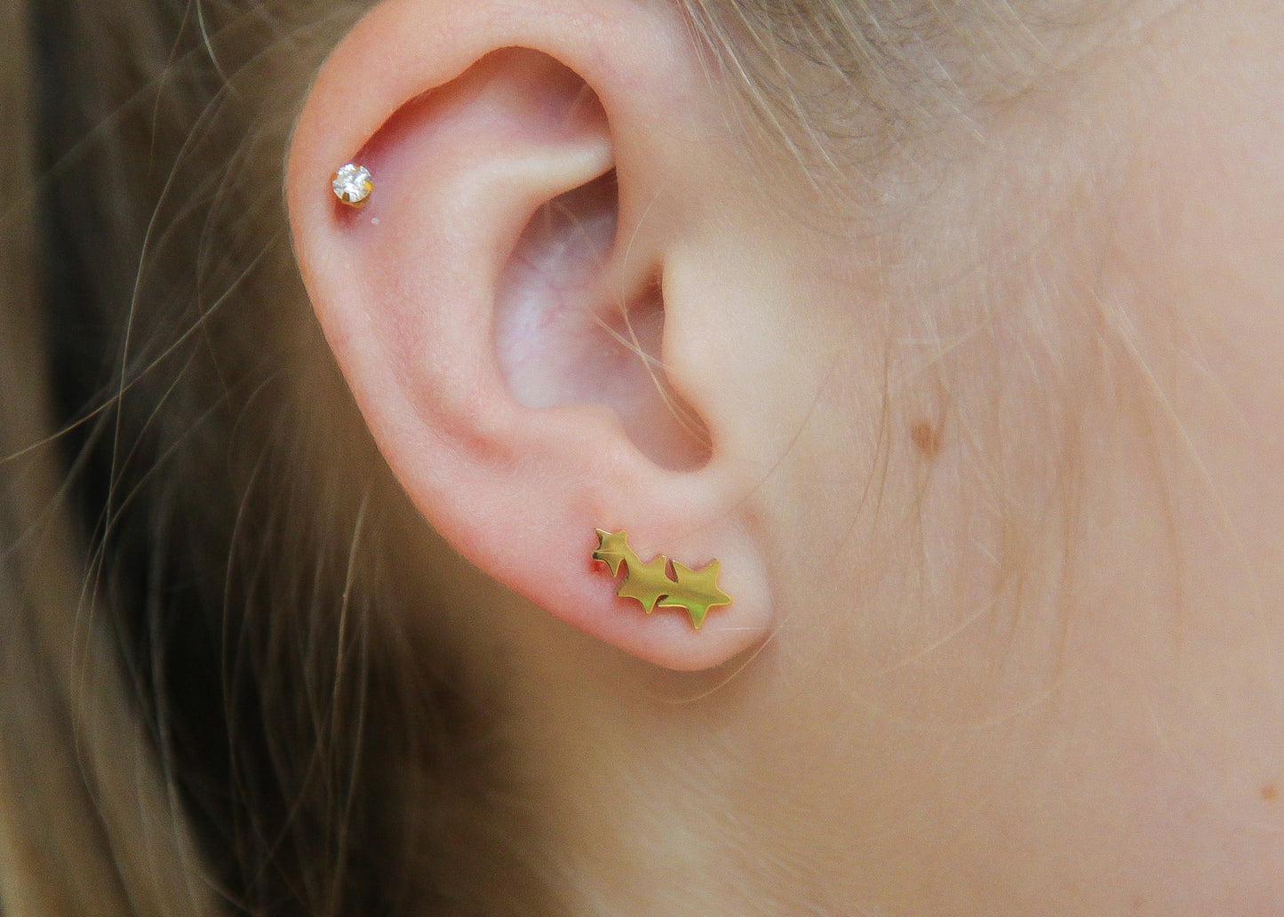 Boucles d'oreilles montantes 3 étoiles en acier doré