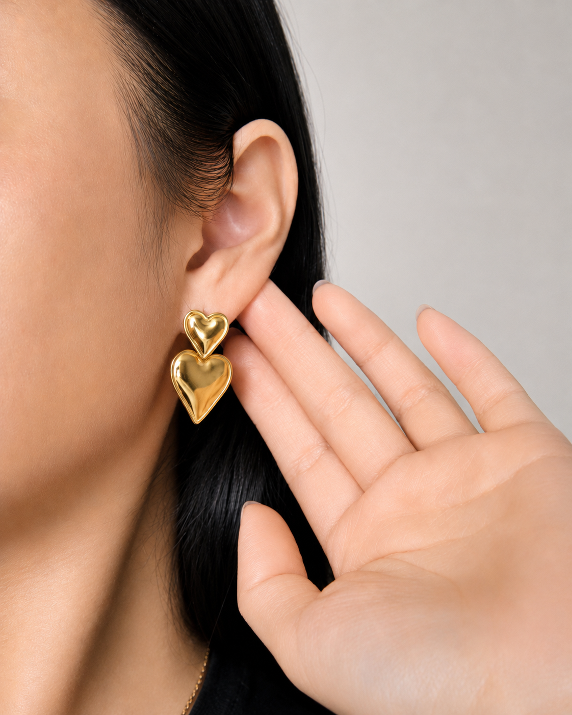 Boucles d’oreilles pendantes double coeurs en acier doré