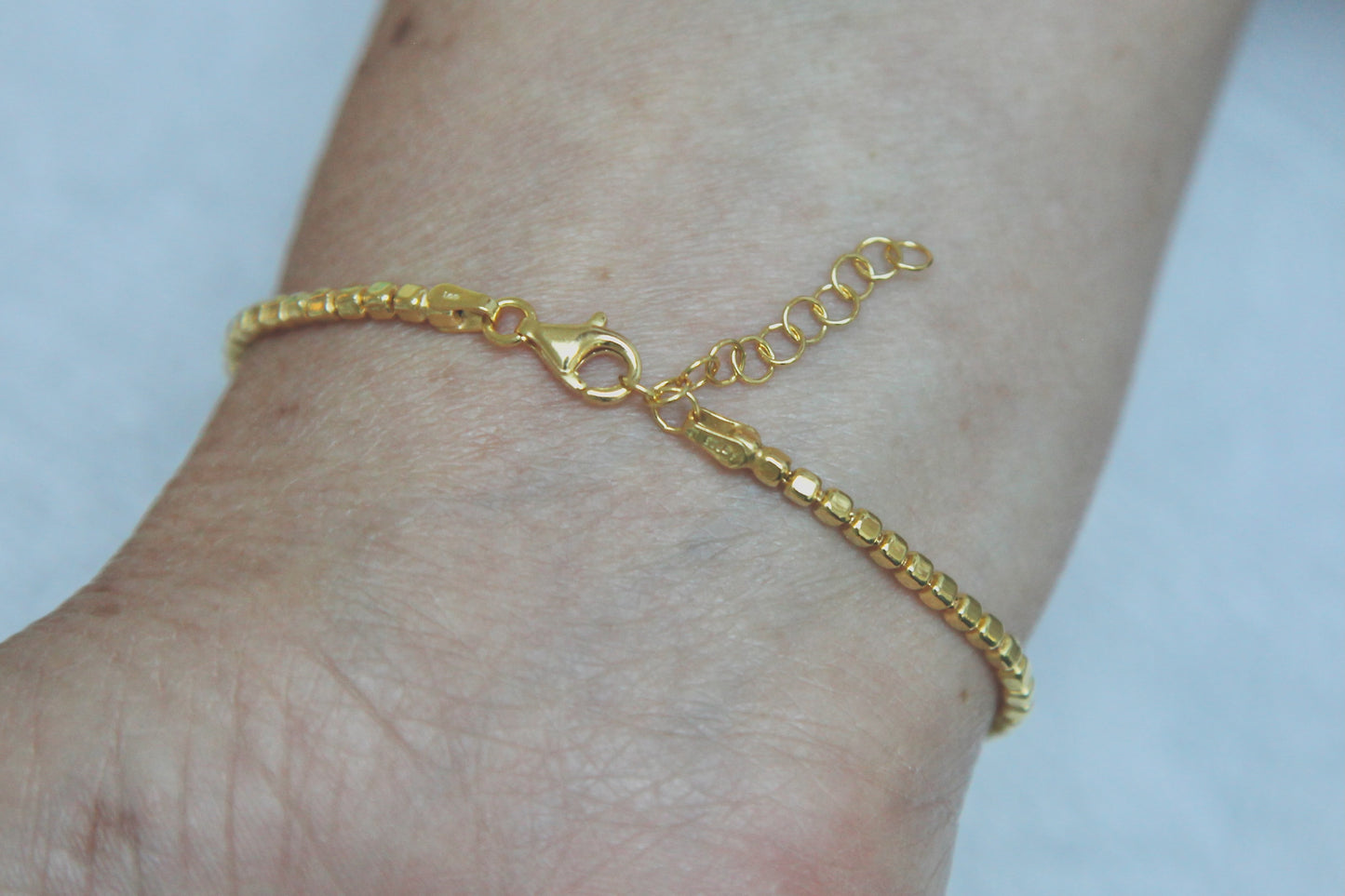 Bracelet perles carrées plaqué or