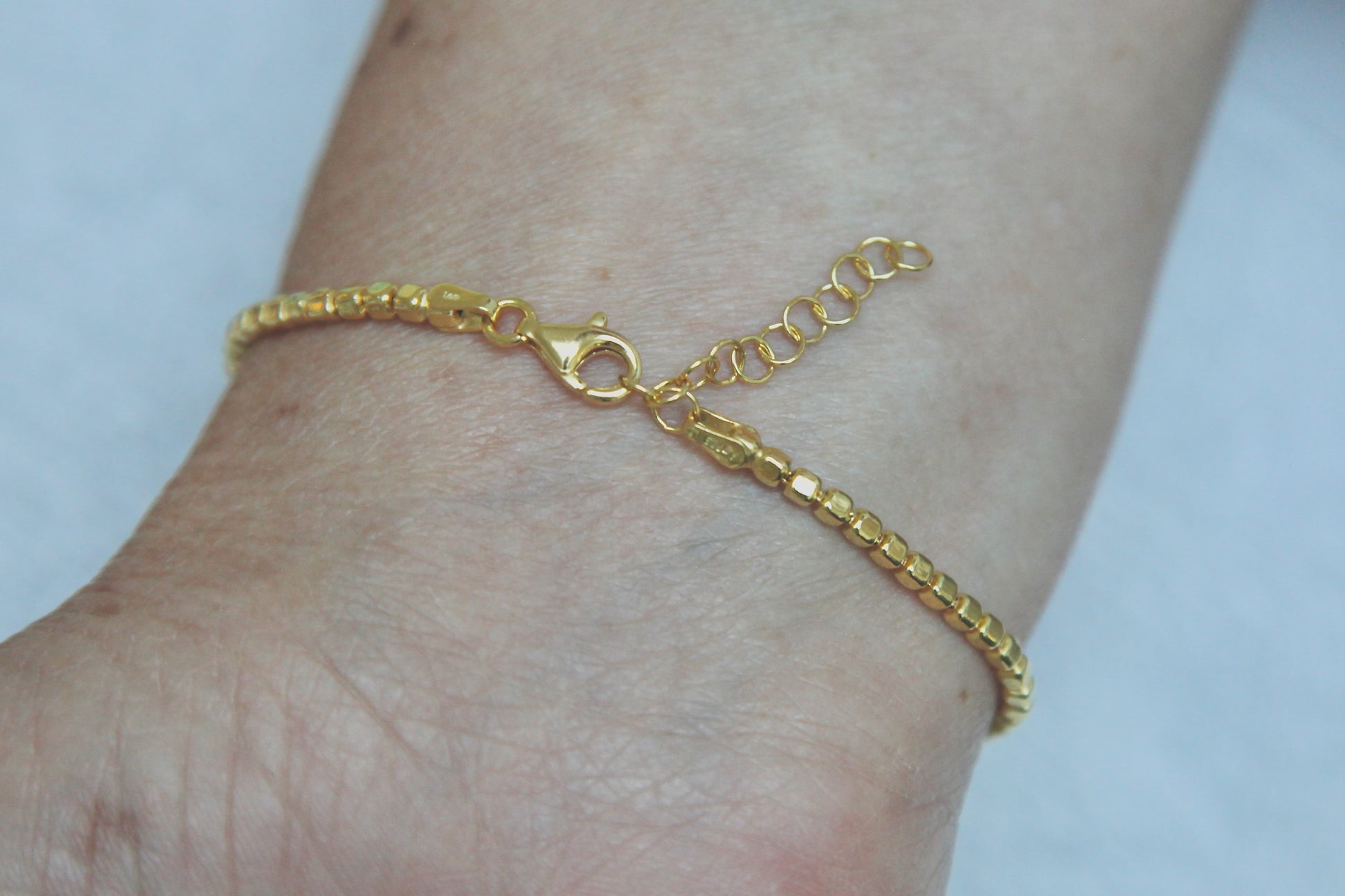 Bracelet perles carrées plaqué or