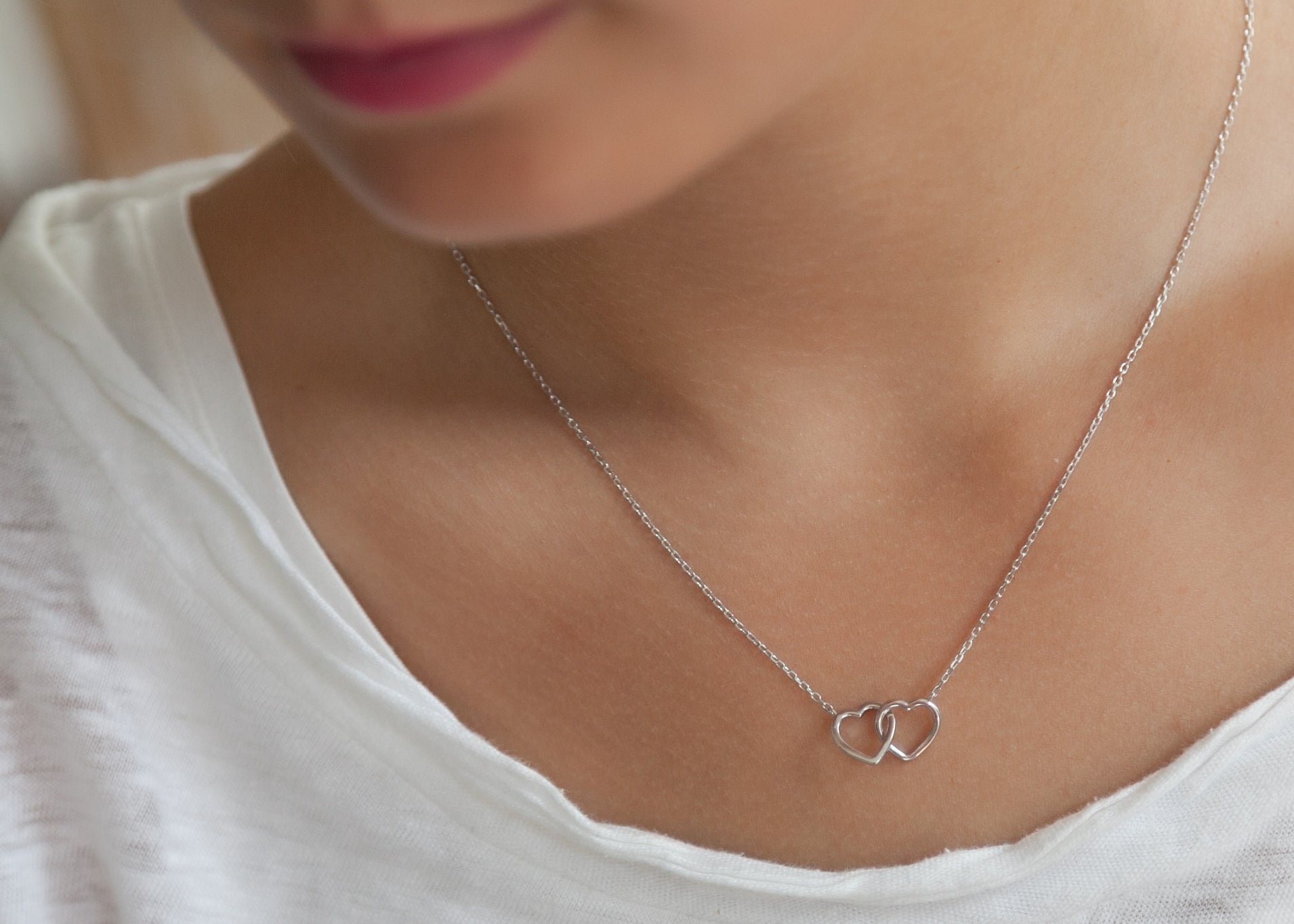 Collier 2 coeurs entrelacés en argent
