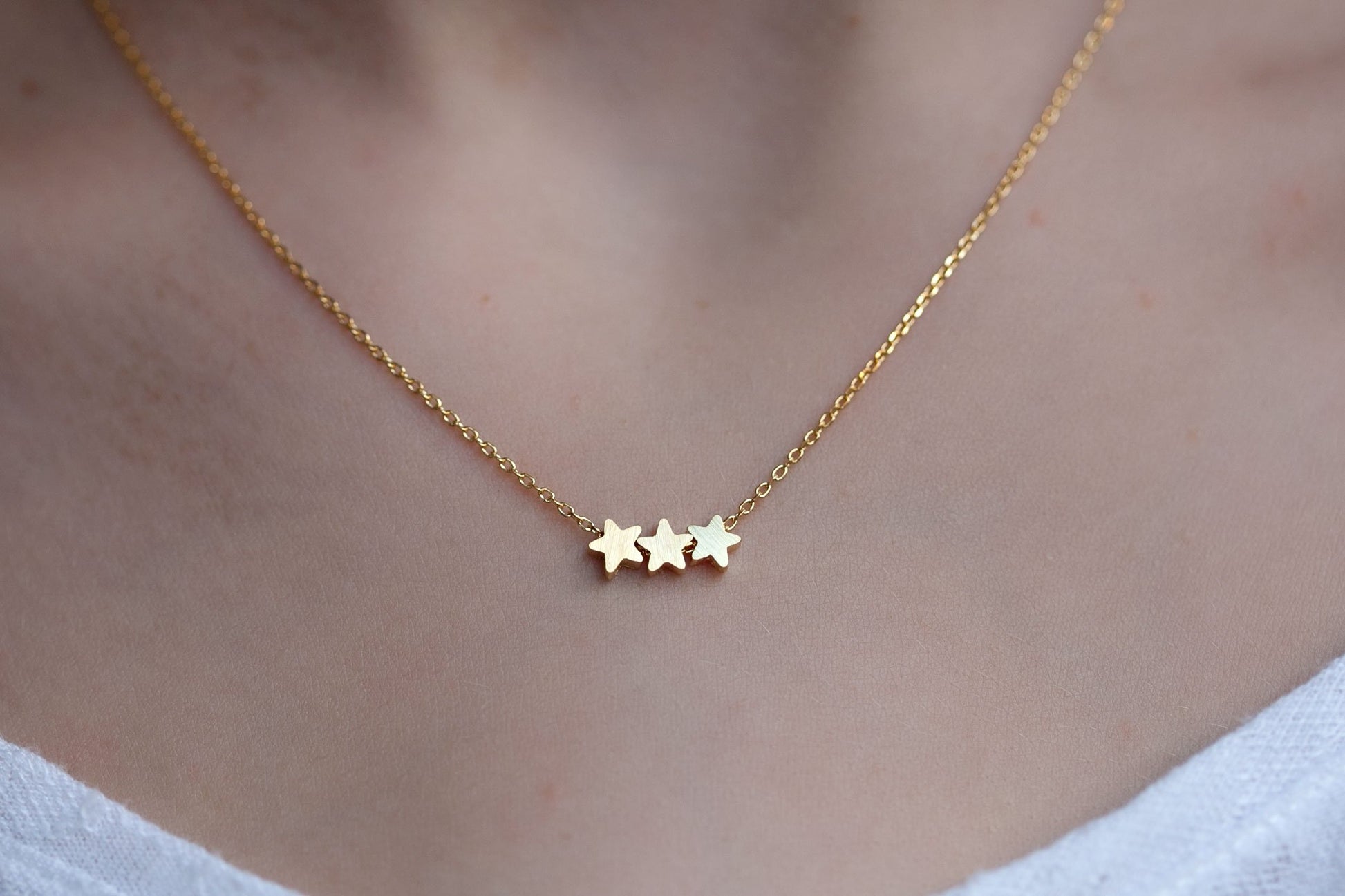 collier 3 étoiles doré 7 bis
