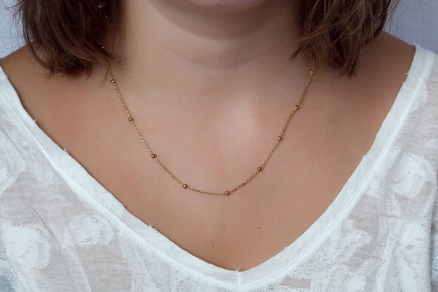 Collier fin boules plaqué or