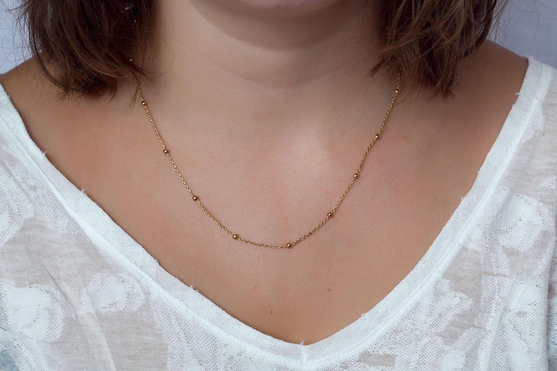 Collier fin boules plaqué or