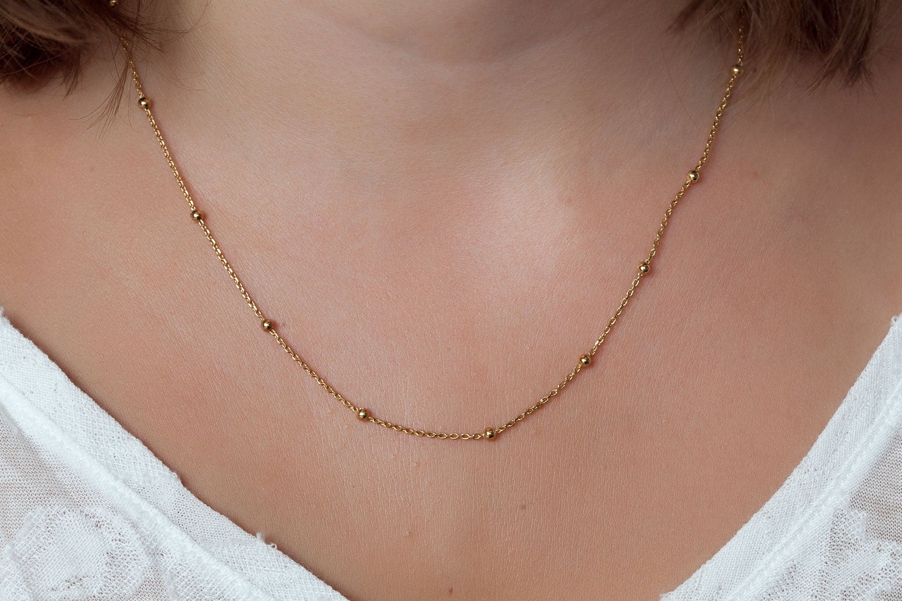 Collier fin boules plaqué or