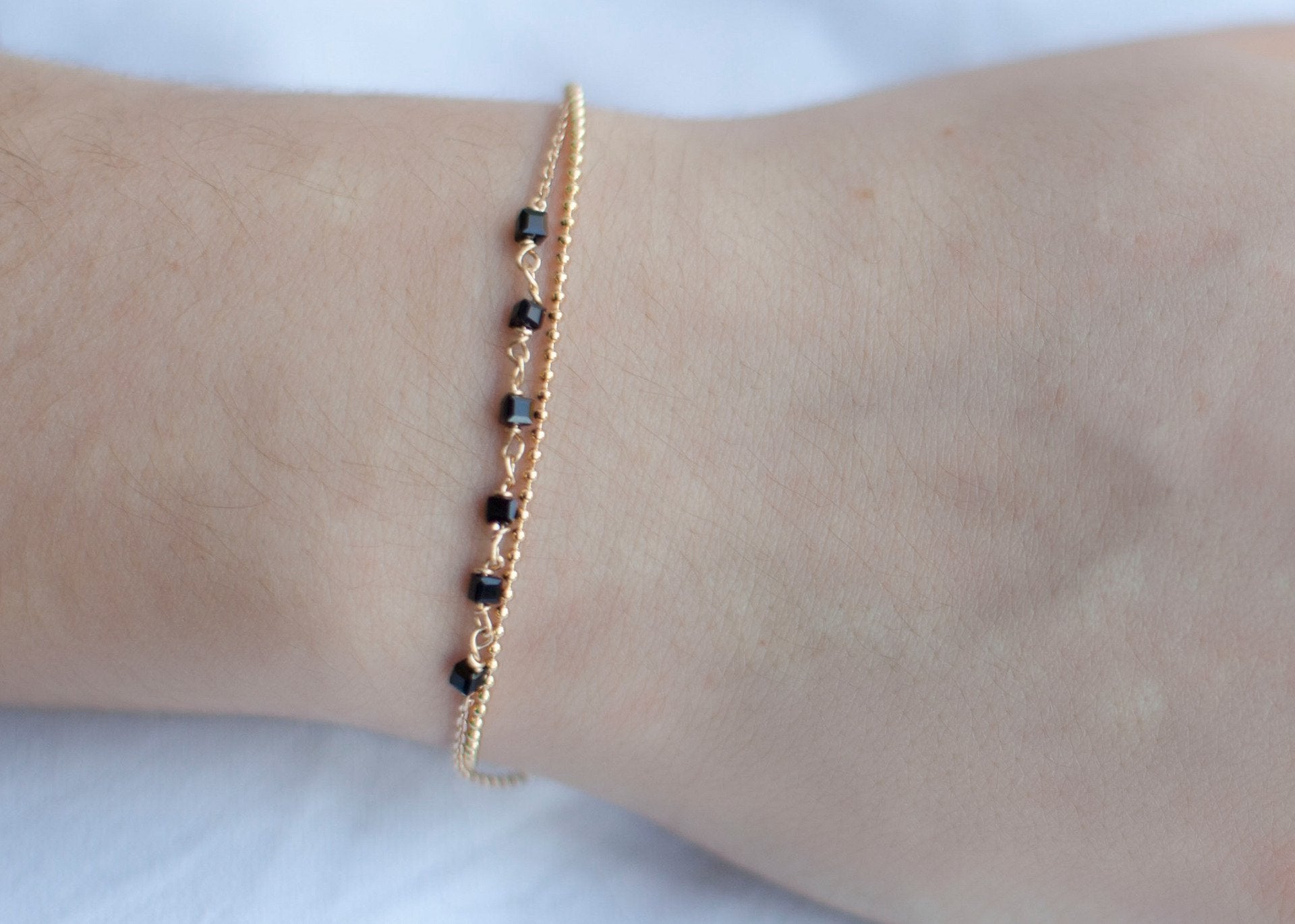 Bracelet 2 rangs perles noires plaqué or